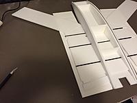 Name: IMG_0916.jpg
Views: 476
Size: 462.6 KB
Description: Step 7:  You will need a couple scrap pieces for this step.  Glue the winglet skin in place tight against the side of the fuselage.