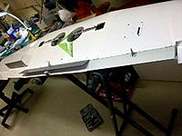 Name: wing mods_4.jpg
Views: 371
Size: 144.7 KB
Description: Inboard facing cheap landing gear and 3-piece split aluminum flaps visible in various angles during dry positioning on the wing