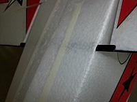 Name: 100_5235.JPG
Views: 131
Size: 450.1 KB
Description: single carbon strip passed through fuselage foam to provide a physical stop/uplock  for the flaps during high-G maneuvring