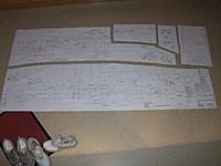 Name: 100_5682cr.JPG
Views: 23
Size: 240.2 KB
Description: I cut the detailed trtue-size color-coded plan in sections that were laid down on the narrow worktable  during each sub-assembly