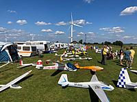 Name: IMG_0093c.jpg
Views: 15
Size: 366.6 KB
Description: Crowded gathering of towed gliders at Bastogne in 2021. Narrow downslope runway with windmills nearby
