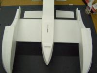 Name: Pdrm2436.jpg
Views: 2477
Size: 74.0 KB
Description: Glue both sponsons in place now, or mount ailerons on then glue. Make sure and get glue in where the tube slides into the sponson reinforcement.