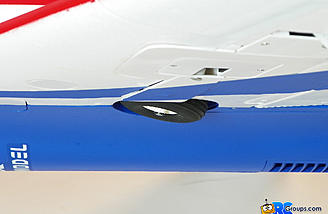 When retracted, the wheels hang down slightly outside of the wing panel.