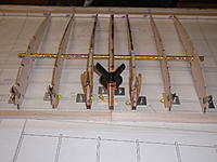 Name: Racer Wing Center section build 001 (3).JPG
Views: 340
Size: 368.7 KB
Description: Center ribs are laid down first with 3/8 id. joiner tube in place.  There are 3/16 ribs on either side with plywood doublers on both side for the wing LE CF mounting pins that are inserted into each rib throught the LE.