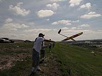 Name: IMG_4238 (Large).jpg
Views: 203
Size: 65.4 KB
Description: Larry's eHawk 1500, converted to sailplane with a slip-on nose gets a launch from Dan.