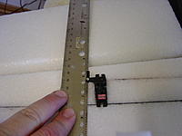 Name: DSC00172.jpg
Views: 248
Size: 138.0 KB
Description: Mark where to cut a slot in the aileron for the control horn.  Make it parallel to the servo but in toward the center slightly so that when the servo arm is full extended the rod and the horn will be in line with maximum mechanical advantage.