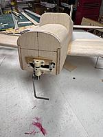 Name: IMG_1773.jpg
Views: 15
Size: 3.66 MB
Description: Here the bracket and nose gear, as well as the push rod for the steering connection are installed.  Not too bad of a fix for not thinking ahead.