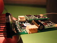 Name: Spektrum 2.4 060.jpg
Views: 404
Size: 54.3 KB
Description: Notice the 3-pin arrangement on the main board that facilitates soldering to it.  There are two receivers soldered straight onto the R921 board by way of these pins, and an additional two recepticles for the remote antennae leads.