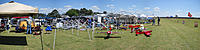 Name: Panorama2012.jpg
Views: 307
Size: 151.5 KB
Description: Panoramic view from Hippo's tent down the flight line.  Too windy for most people to put the tops on their Pop Ups...