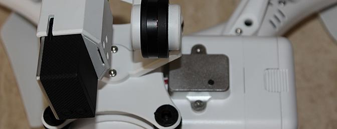 The small black button near the center of the photo shows the gimbal reset button. Unfortunately, pressing it didn't solve the problem of the lack of remote tilt control.