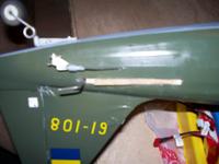 Name: Damaged stabilizer.jpg
Views: 230
Size: 44.0 KB
Description: Here's where the stabilzer made its clean break from the tail section.  The joiner wire poked a small hole through the top of the elevator half.  I used the hole later on to CA the joiner back in place.