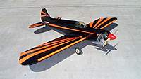 Name: project duck 007 (Medium).jpg
Views: 423
Size: 51.1 KB
Description: I rather like the black and day-glo orangey-red color scheme.  Won't be a problem seeing this thing in the air!  The trim is actually more bright orange than it appears to be in the photo.  Reminds me of the Batmobile.
